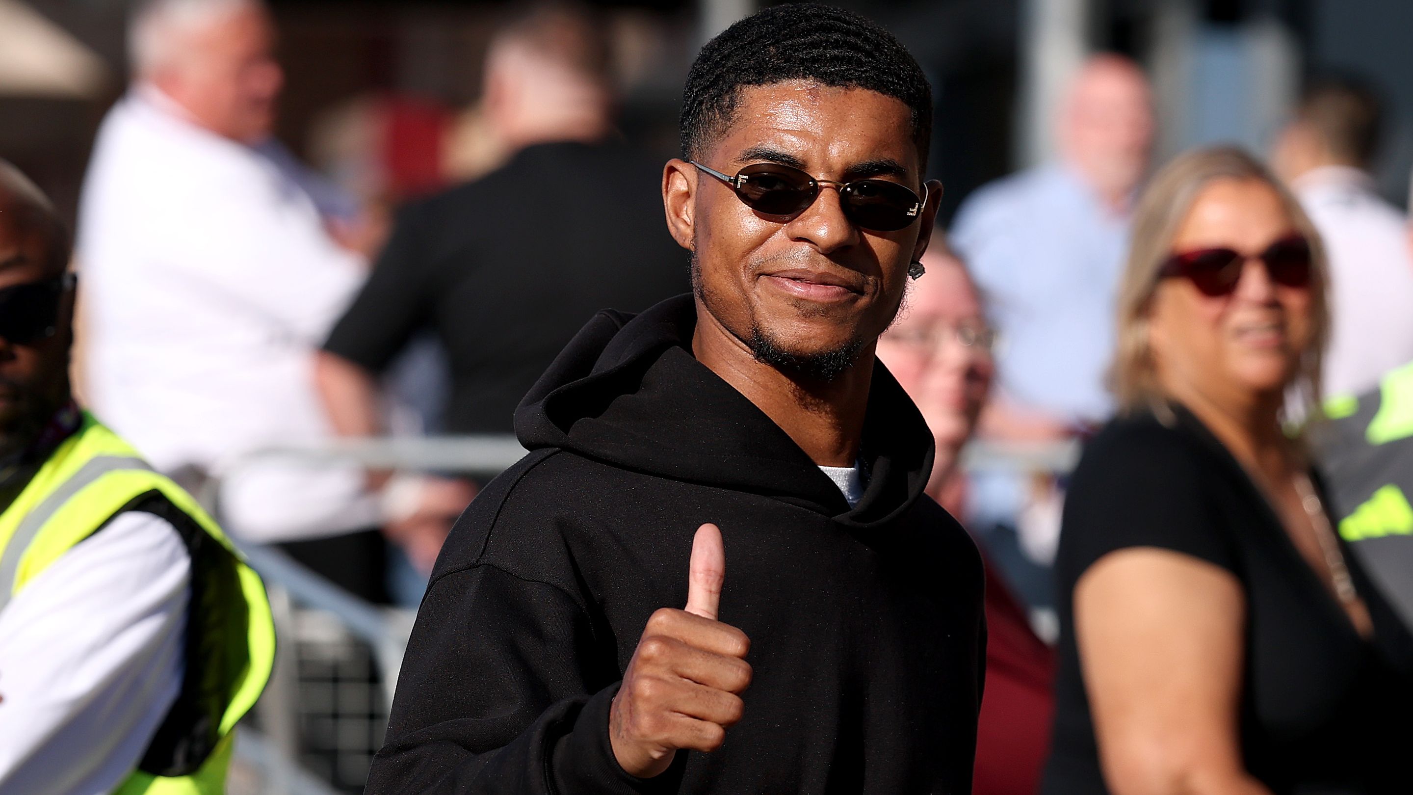 VIDEO: Marcus Rashford suited & booted! Man Utd outcast all smiles as he arrives at Barcelona headquarters to complete loan transfer ahead of official unveiling