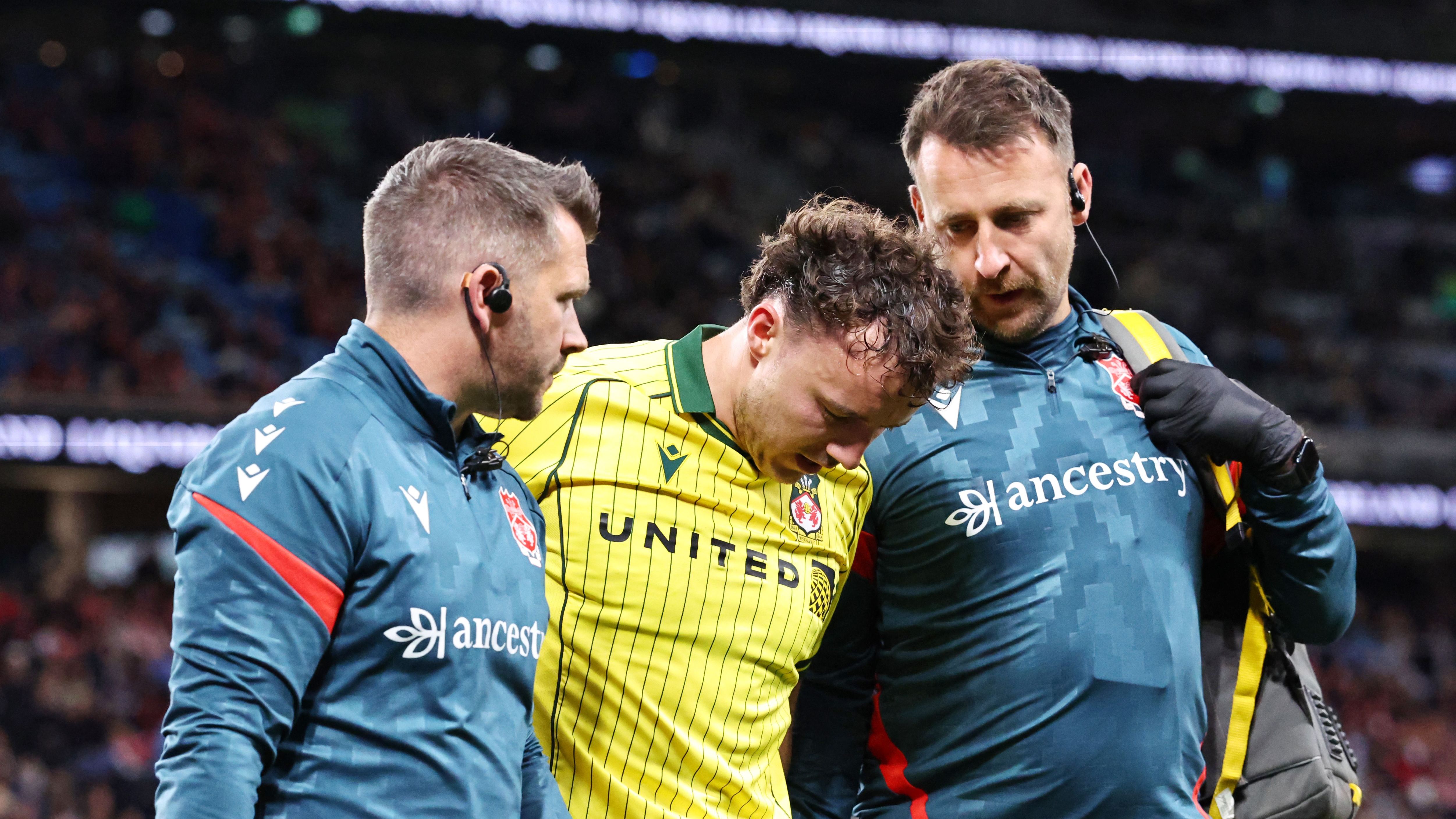 Wrexham let down by fumbling goalkeeper Callum Burton in disappointing pre-season loss to Sydney FC as worrying Ollie Rathbone injury compounds misery for Ryan Reynolds and Rob McElhenney